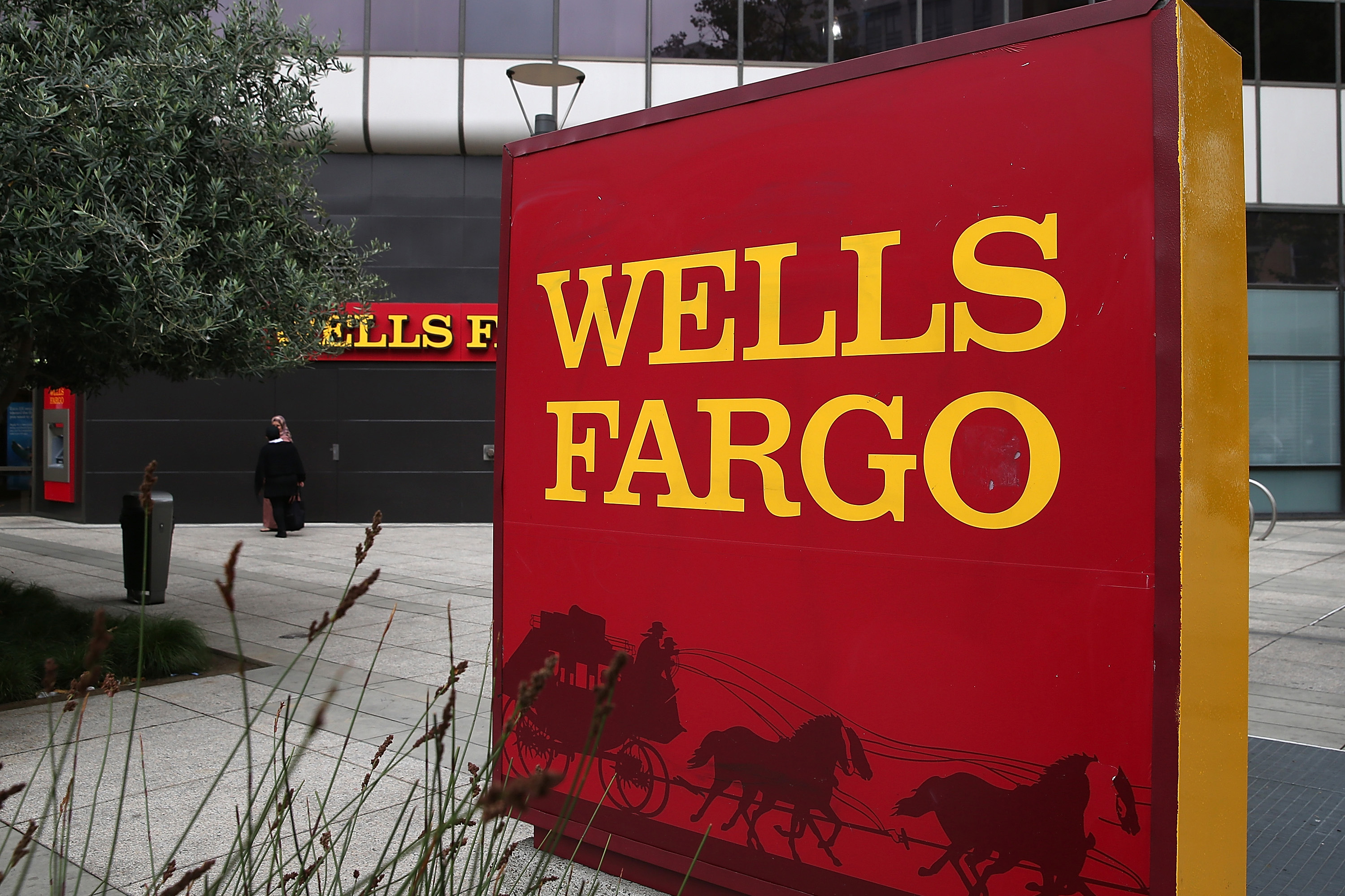 OAKLAND, CA - OCTOBER 11: A sign is posted in front of a Wells Fargo bank on October 11, 2013 in Oakland, California. Wells Fargo reported a 13 percent increase in third-quarter profits with a net income of $5.6 billion, or 99 cents a share compared to $4.9 billion, or 88 cents a share one year ago. (Photo by Justin Sullivan/Getty Images)